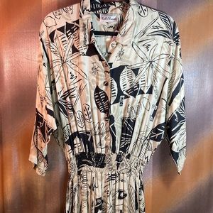 Vintage 90’s black and tan jumpsuit.  Reds threads.  size M. 48” chest B8